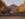 The exterior of the Philadelphia Museum of Art surrounded by foliage on an autumn day.