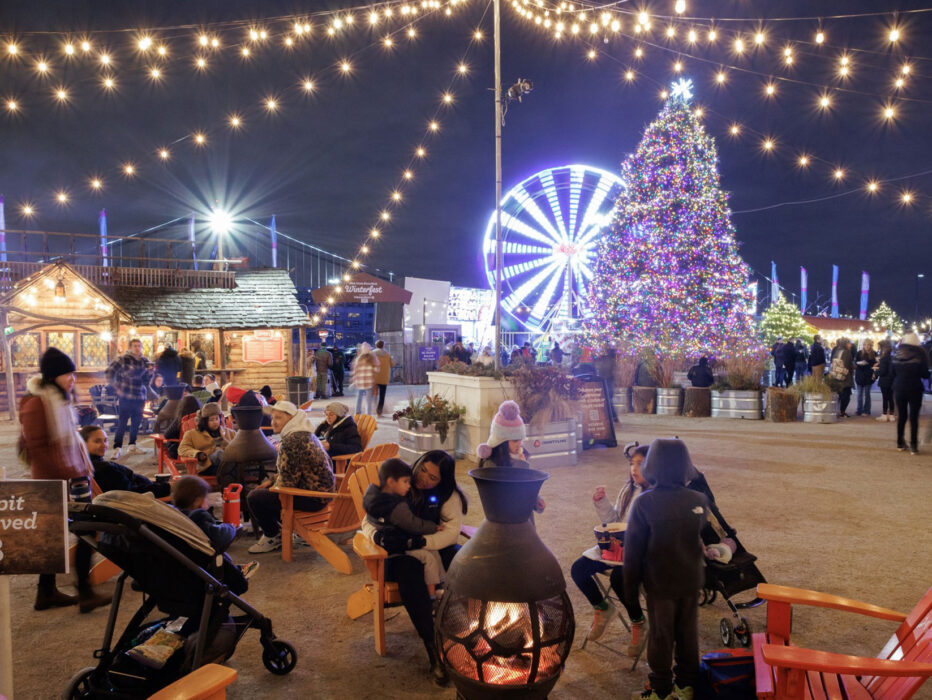 People gather around a firepit at Independence Blue Cross RiverRink Winterfest.