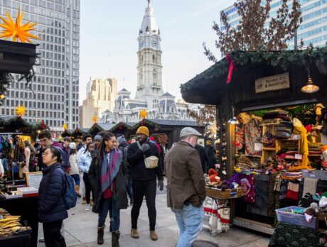 Shoppers walking through Christmas Village