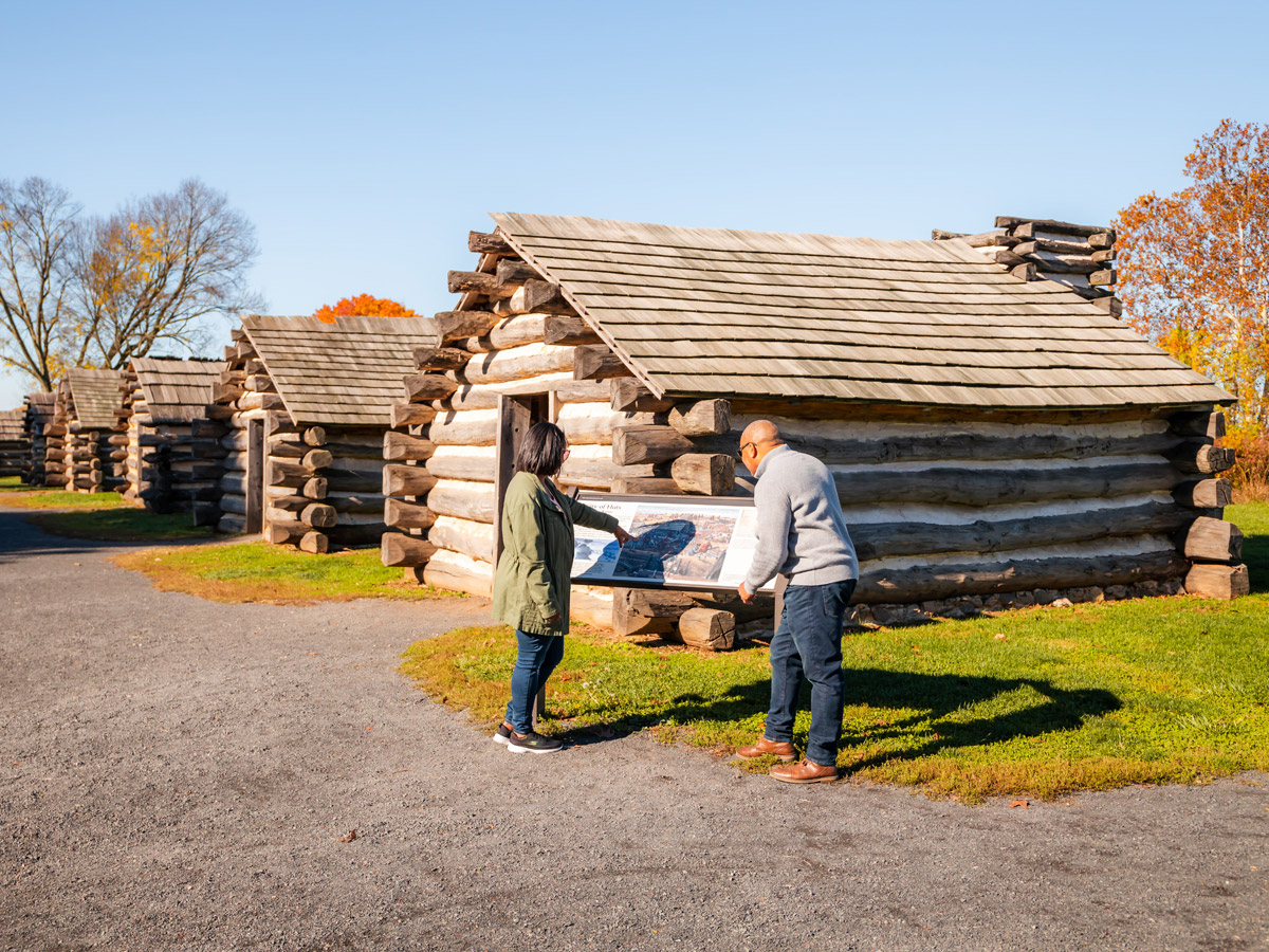 People looking at huts at Valley Forge National Historical Park