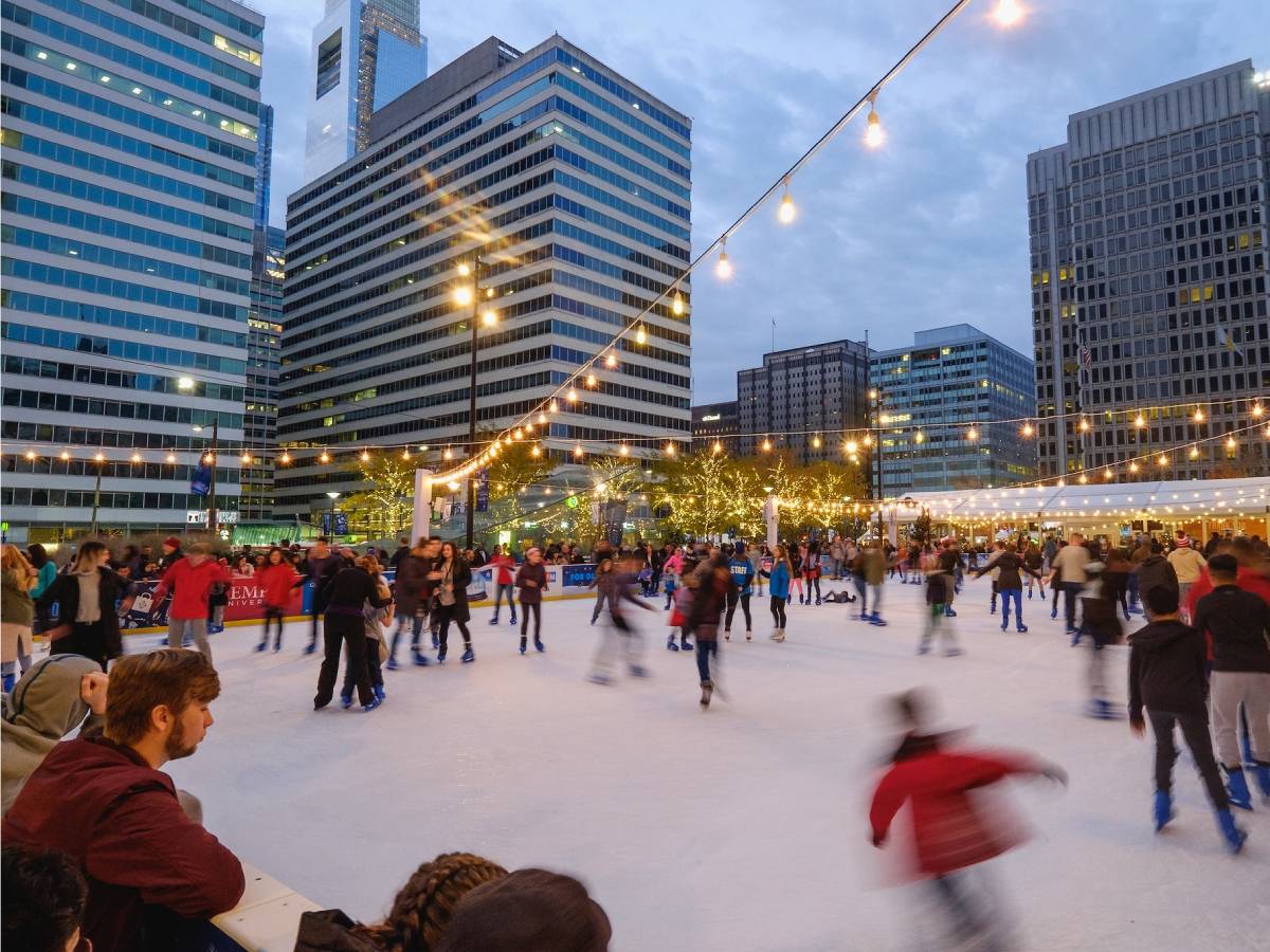 People skating on the Rothman Ice Rink during Winter at Dilworth Park