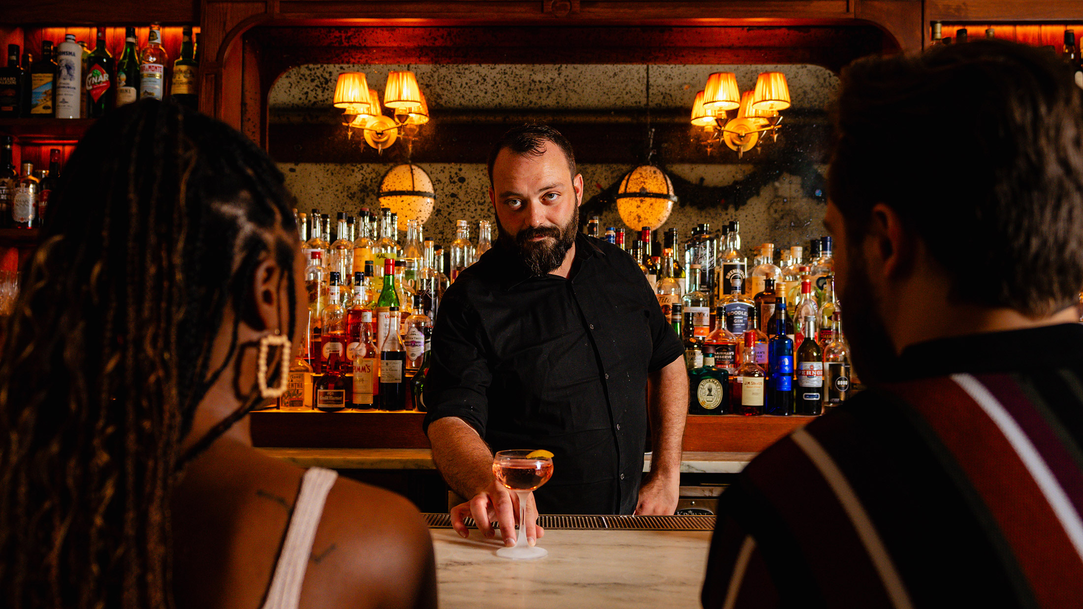 Couple and a bartender at Friday Saturday Sunday