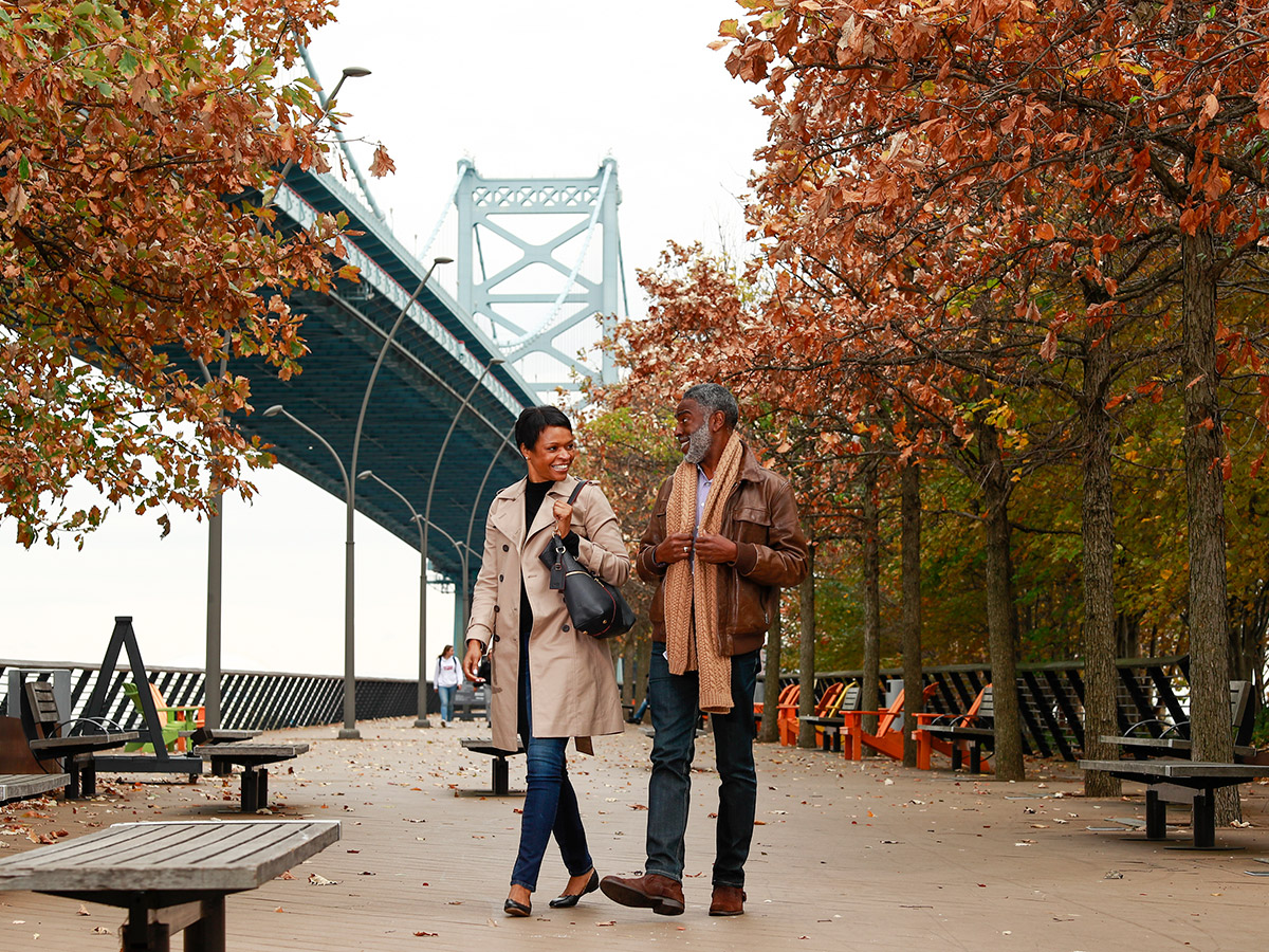 People walking through Race Street Pier in the fall