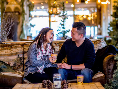 Couple sitting around a table at the Independence Blue Cross RiverRink Winterfest