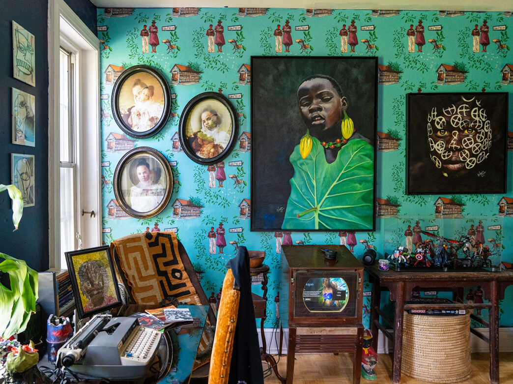 Exhibit at Colored Girls Museum. Pieces of photography and paintings displayed on wall with teal wallpaper.