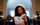 Ms. Joyce Abbott staring into an opened book