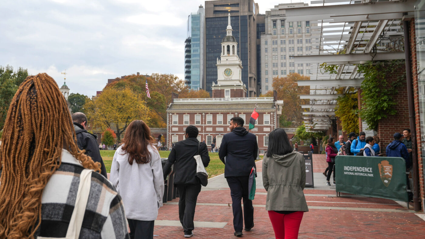 Tour group walking through Independence Mall on The Black Journey: African American Walking Tour of Philadelphia