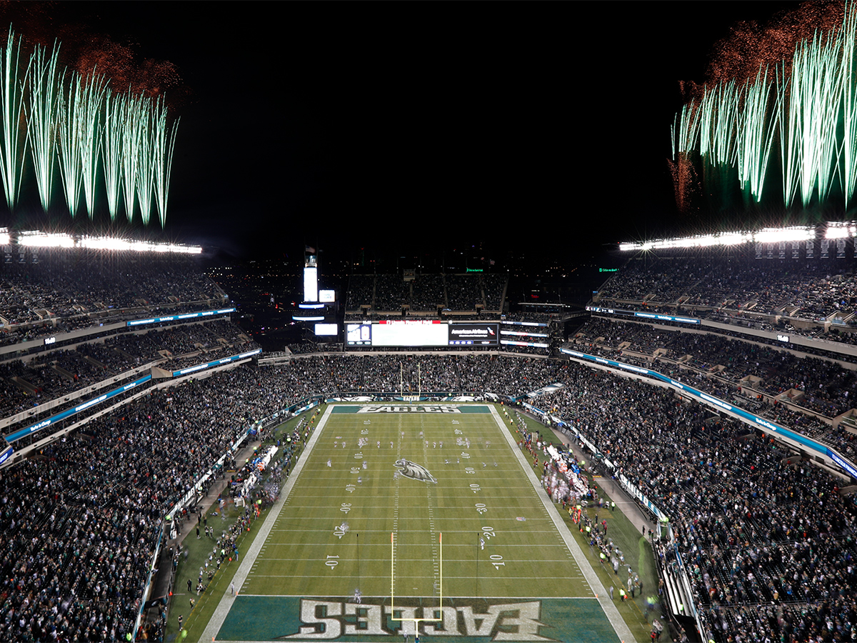 Nighttime Philadelphia Eagles games with green fireworks at Lincoln Financial Field.