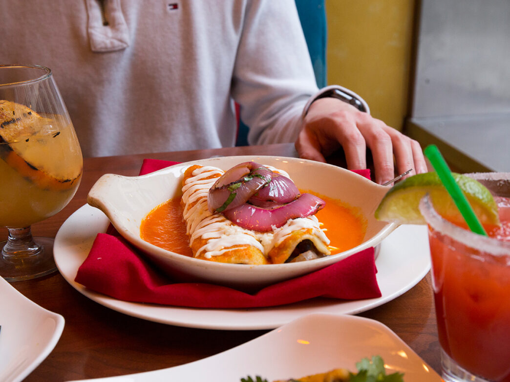 A dish of enchiladas is displayed on a table at El Vez in Philadelphia.