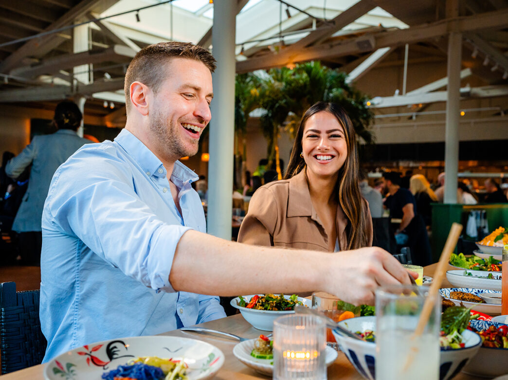 A couple laughs while eating a meal at Kalaya in Philadelphia.