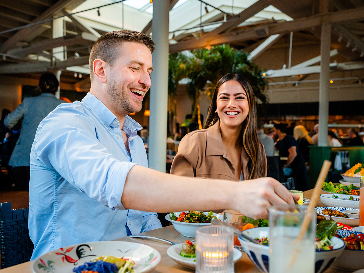 A couple laughs while eating a meal at Kalaya in Philadelphia.