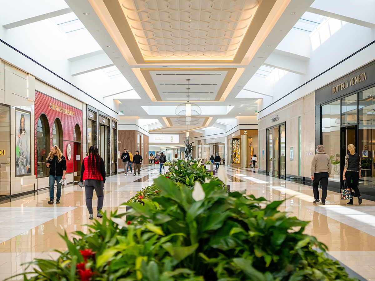 People walk through shopping corridor at King of Prussia Mall.