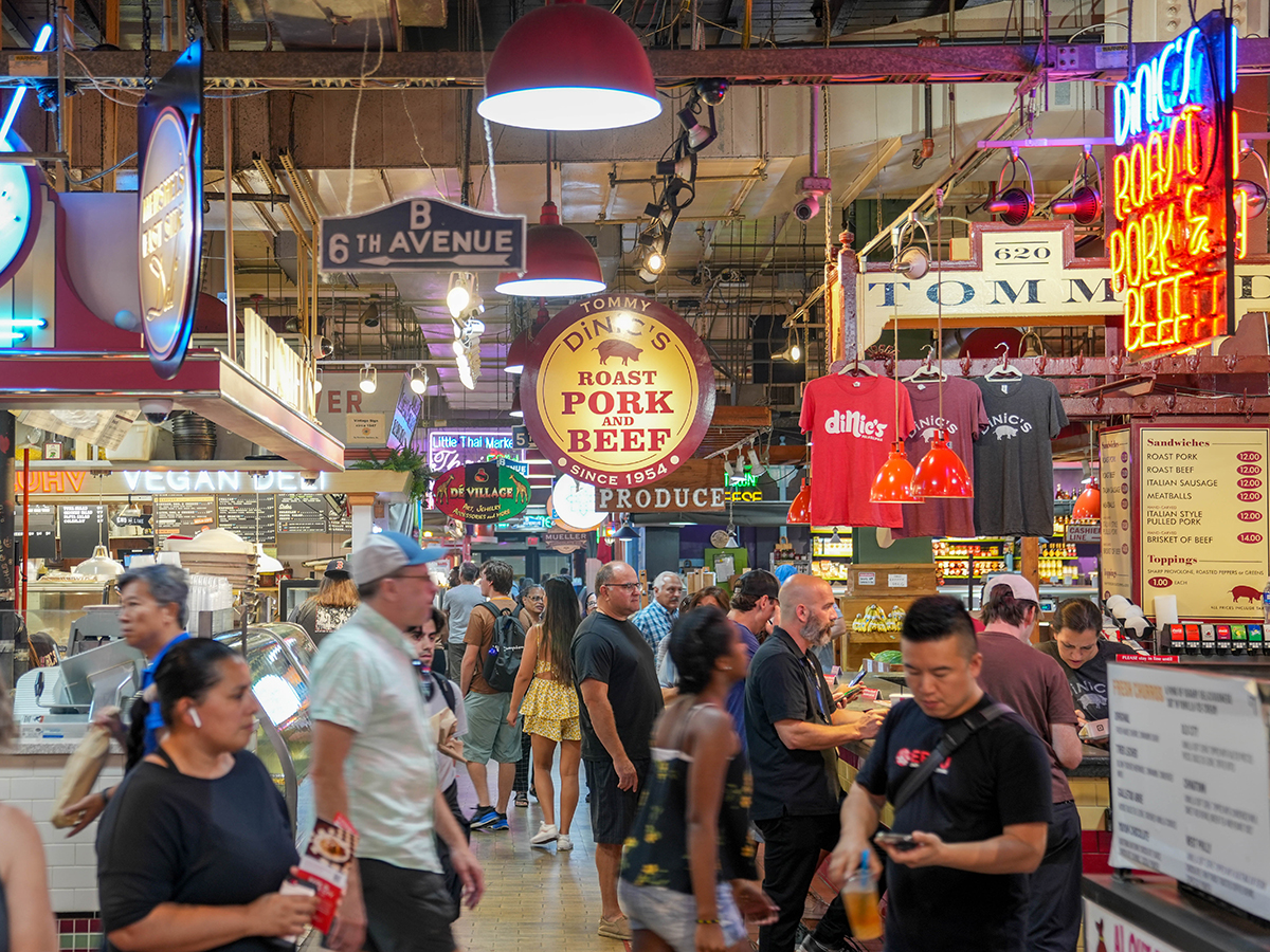 People walk through Reading Terminal Market near DiNic's counter.