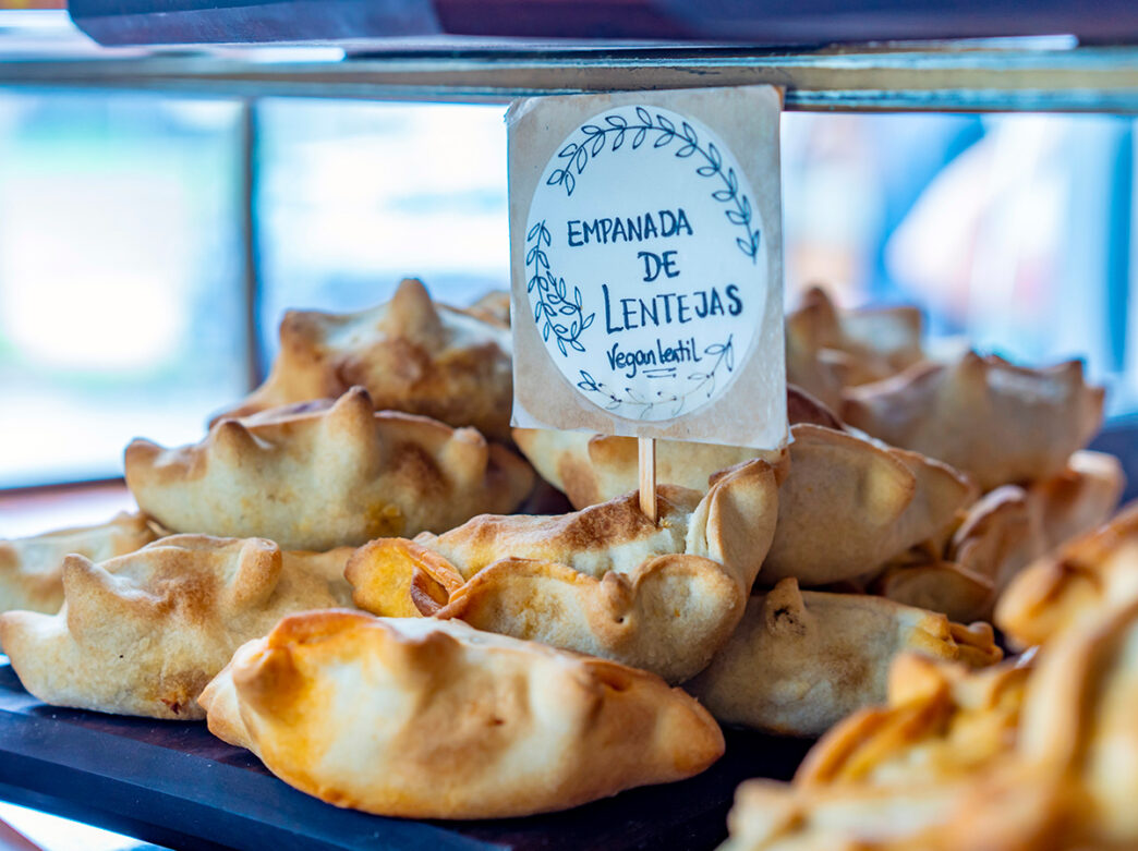 Vegan lentil empanadas are displayed in a glass bakery counter at Jezabel's in Philadelphia.