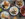 Hands reach for food in an overhead shot of food at The New Lou & Choo's in Philadelphia.