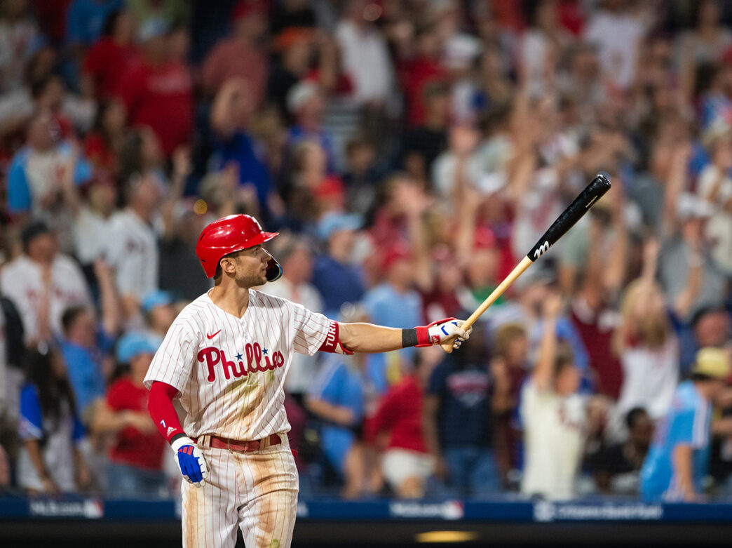 Trea Turner of Philadelphia Phillies holds up a baseball bat in during a game at Citizens Bank Park.