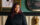 Chef Diana-Widjojo of Rice and Sambal poses for a photo in her restaurant while wearing a black chef jacket.