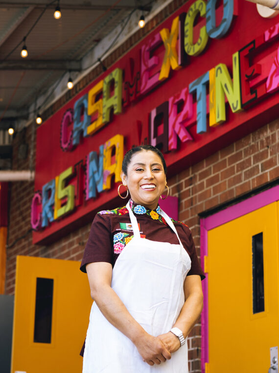 Chef Cristina Martinez standing in front of Casa Mexico in South Philadelphia