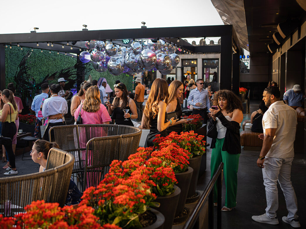 People attend the Spring Awakening event at Stratus Rooftop Lounge.