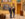 Two people wearing blazers and jeans look up at framed artwork in a gallery at the Barnes Foundation.