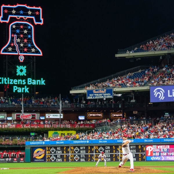 A baseball game takes place at Citizens Bank Park at night.