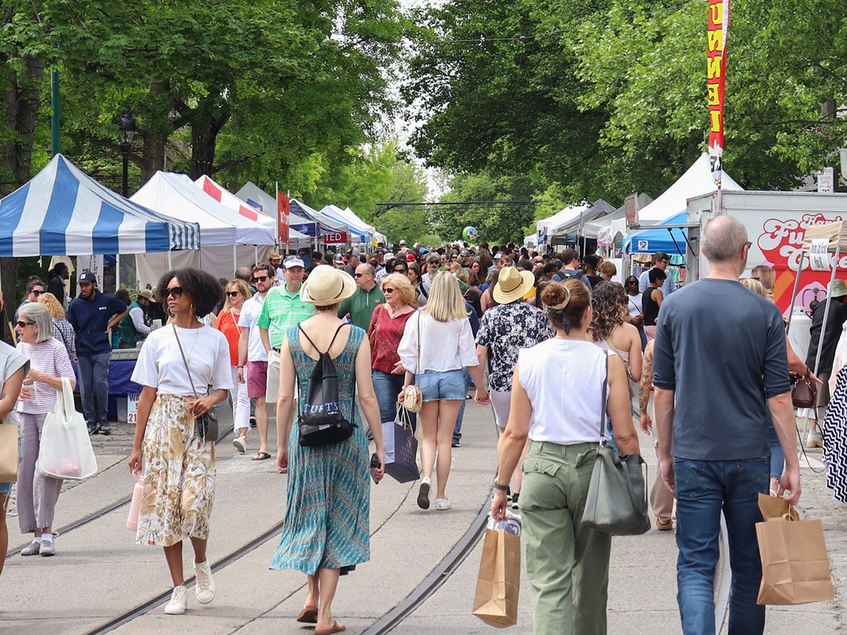 Attendees of the Chestnut Hill Home & Garden Festival walk and shop at the vendors set up along Germantown Avenue.
