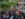 A woman stands at a podium and speaks to a crowd in front of Independence Hall for the Wawa Welcome America Celebration of Freedom event.