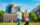 Two men walk through Independence Mall with Independence Hall in the background.