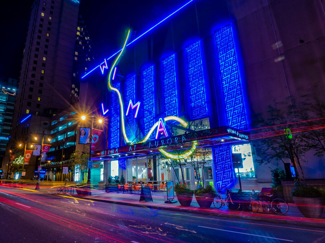 An exterior of shot of The Wilma Theater at night.