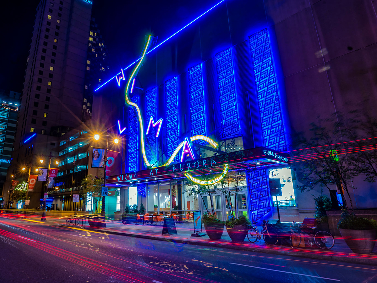 An exterior of shot of The Wilma Theater at night.