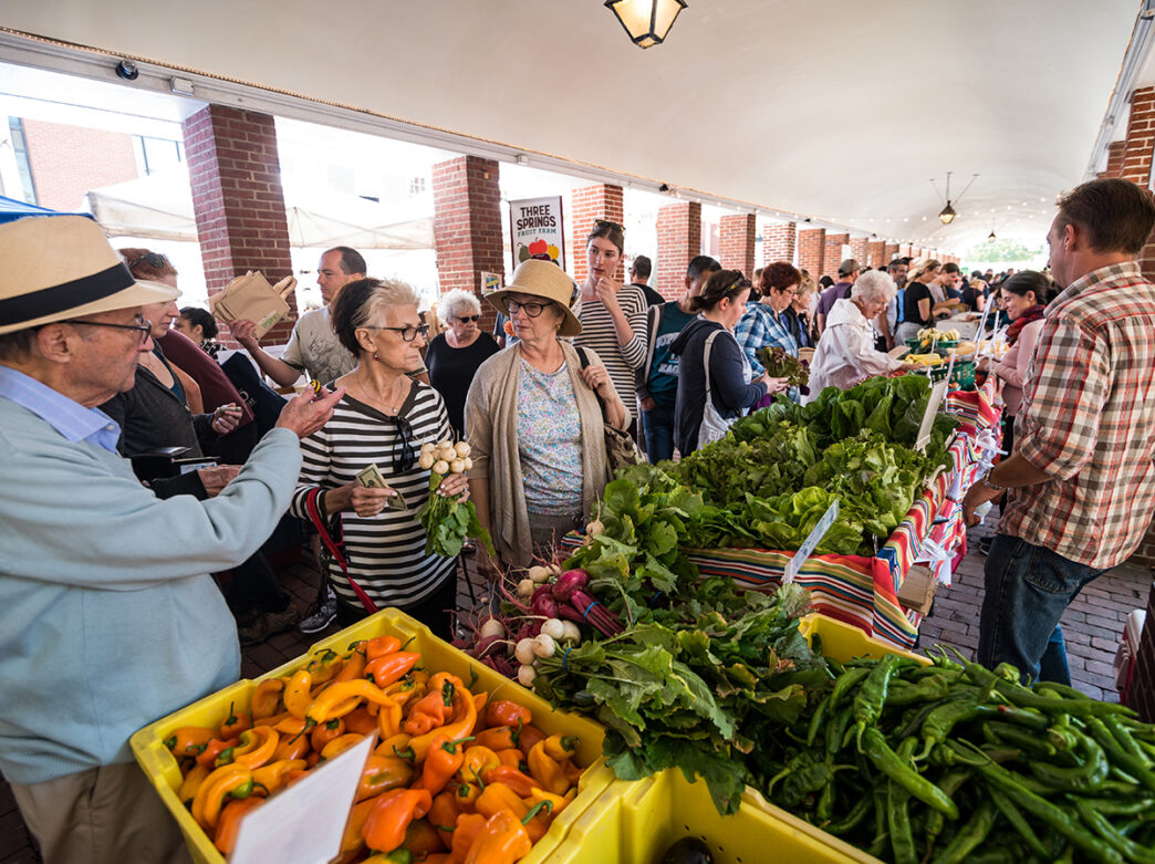 People shop for lettuce, peppers and more at the Headhouse Farmers Market in Philadelphia.