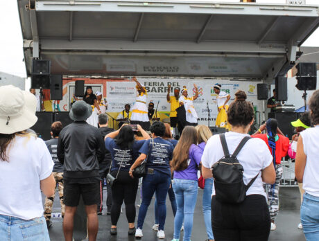 A crowd watches dancers on stage at La Feria del Barrio event in Philadelphia.