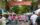 People walk through a street lined with vendor tents at the Mushroom Festival in Kennett Square.