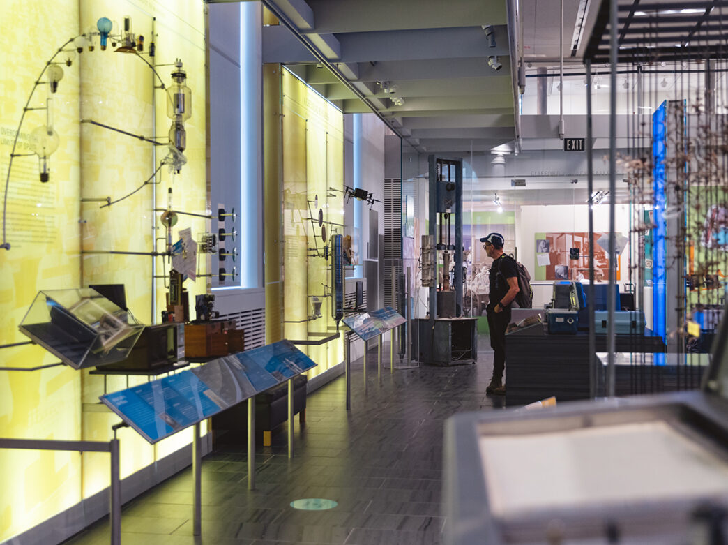 A person explores an exhibit and look at a display at the Science History Institute.