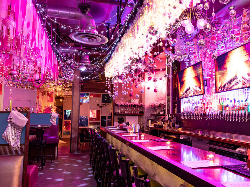 Holiday ornaments and tinsel hang from every part of The White Elephant, a holiday pop-up bar in Philadelphia