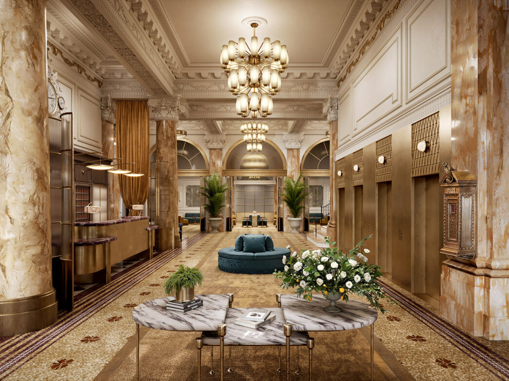 Foto do Bellevue Hotel com enfeites brancos e dourados, móveis azuis, um lustre, colunas de mármore e plantas verdes