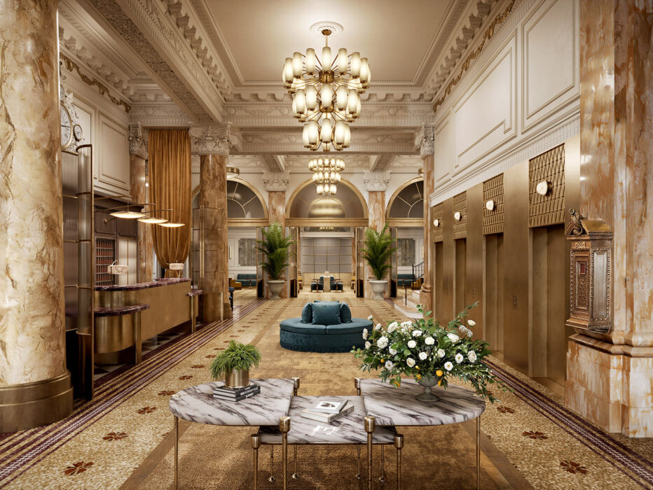 Shot of the Bellevue Hotel featuring white and gold trimmings, blue furniture, a chandelier, marble columns and green plants