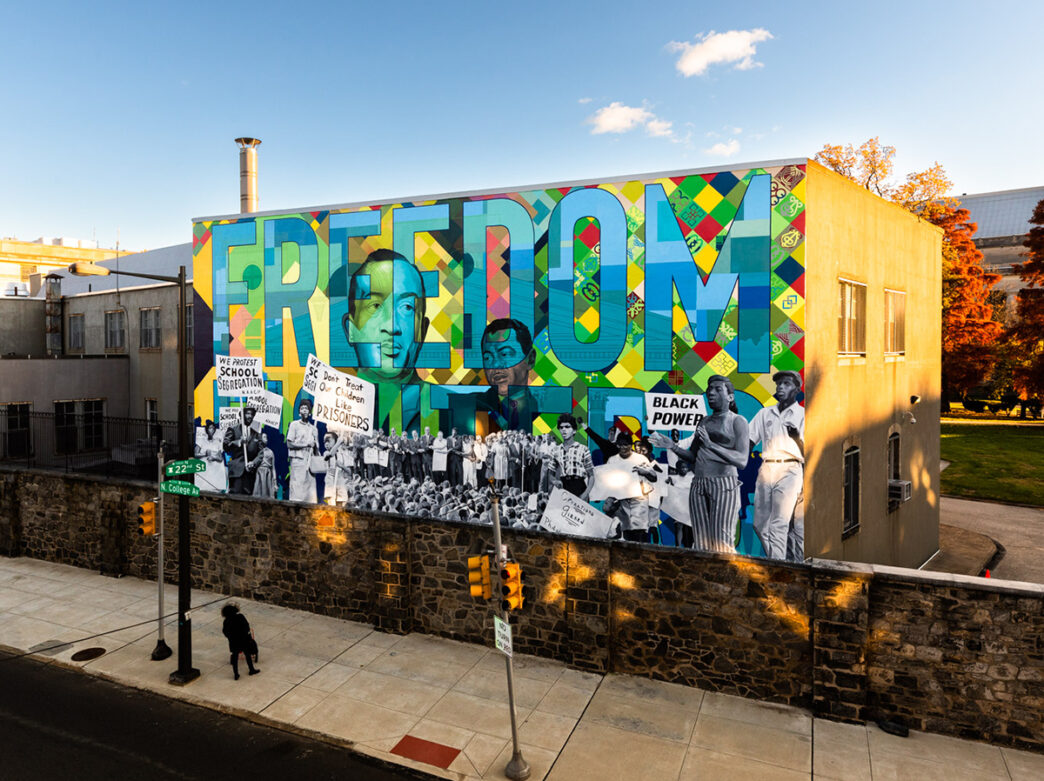 A colorful mural of the Cecil B. Moore Freedom Fighters with FREEDOM largely written at the top.