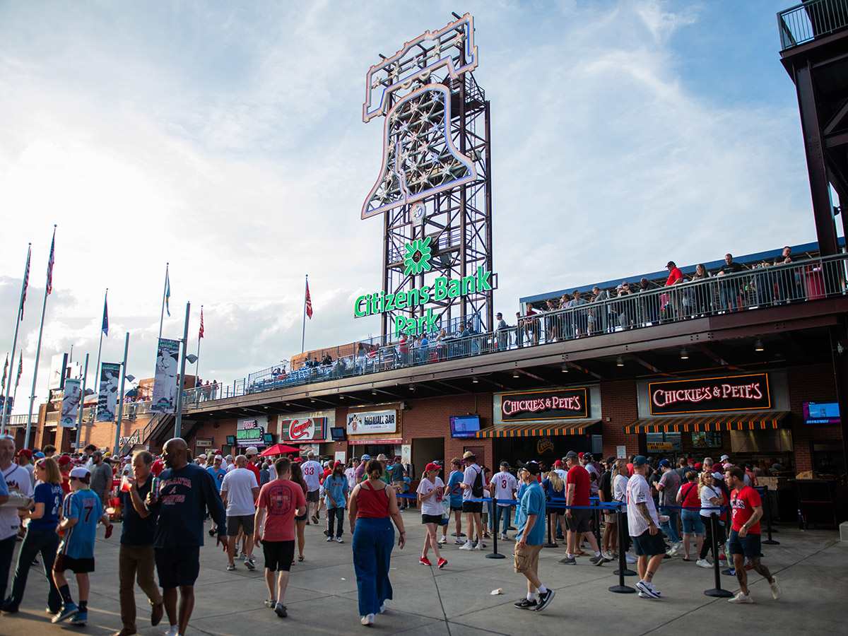 Fans enjoy the bustling pre-game atmosphere near the Chickies & Pete's stands at Citizens Bank Park.