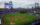 A panoramic view of the Phillies game at Citizens Bank Park showcases the vibrant green field, the towering scoreboard, and the Philadelphia skyline in the distance.