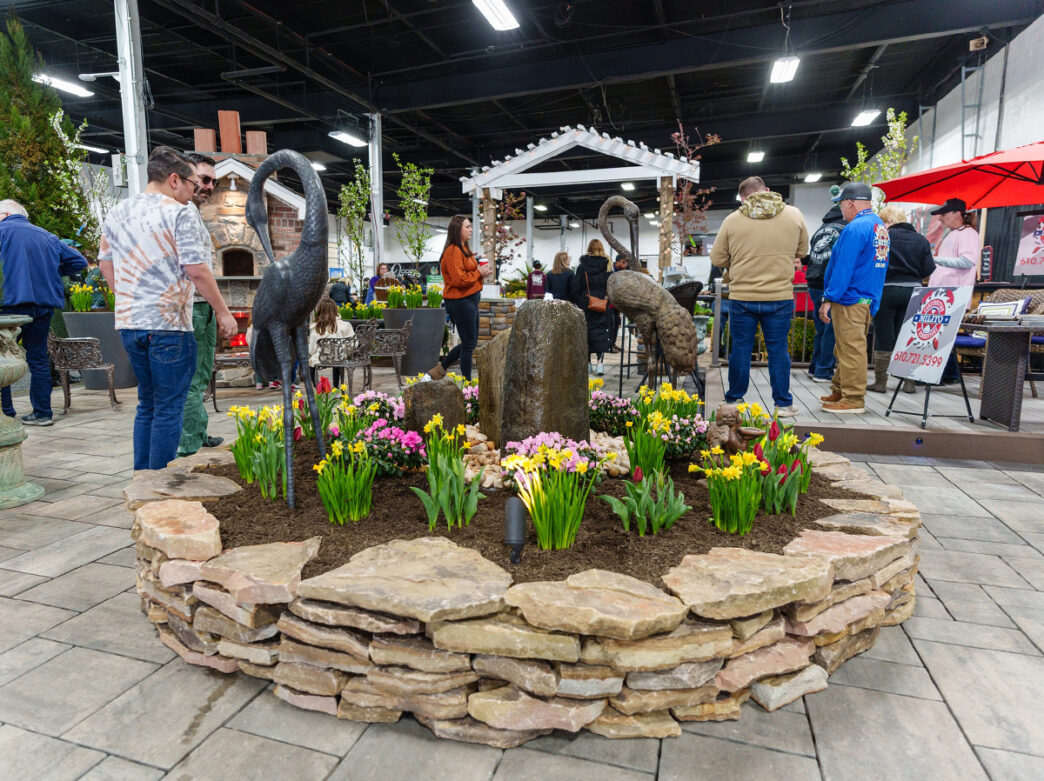 People walk around the landscaping displays at the Philly Home + Garden Show.