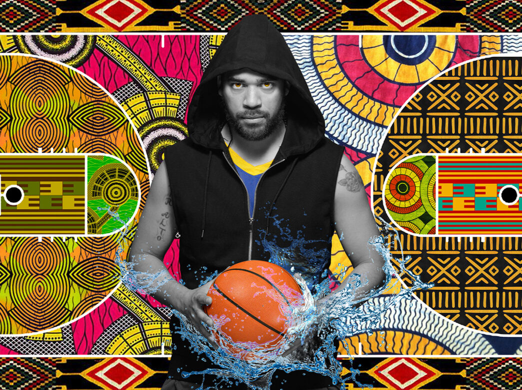 A man wearing a cut-off zipper sweatshirt holds a basketball in his hands. Water splashes upward from underneath the basketball. The man's eyes are colored orange.