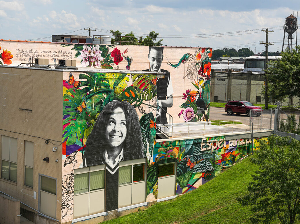 The size of Esperanza Art Center in Philadelphia, which is decorated with a colorful mural. The mural features colorful flora, butterflies and two kids.