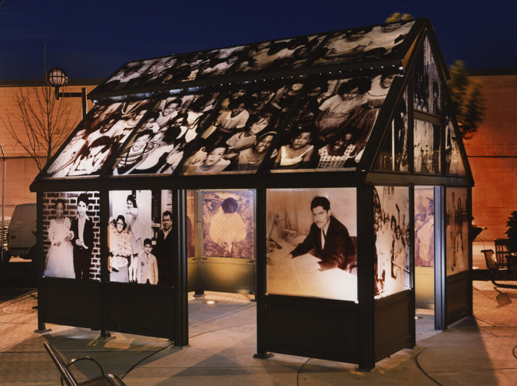 Black and white photographs transferred to glass window panes create an outdoor casita in a courtyard in Philadelphia.