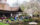 Visitors gather around Shofuso Japanese House and Garden in Philadelphia, admiring the cherry blossoms and enjoying the serene pondside setting during the annual Cherry Blossom Festival.