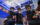 A group of players in motion-tracking suits, VR headsets and vests engage in a fully immersive virtual reality experience at Sandbox VR, surrounded by futuristic tech.