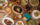 A variety of Mexican dishes, including tortillas, a tuna tostada and carne asada, sit on a wooden table at Amá
