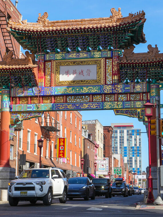 An intricate arch decorated in Qing Dynasty style spans a street in Philadelphia.