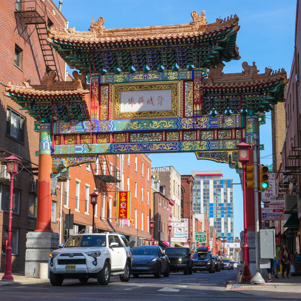 An intricate arch decorated in Qing Dynasty style spans a street in Philadelphia.