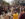 A crowd of onlookers watches a dancer and group of drummers perform at the ODUNDE Street Festival.